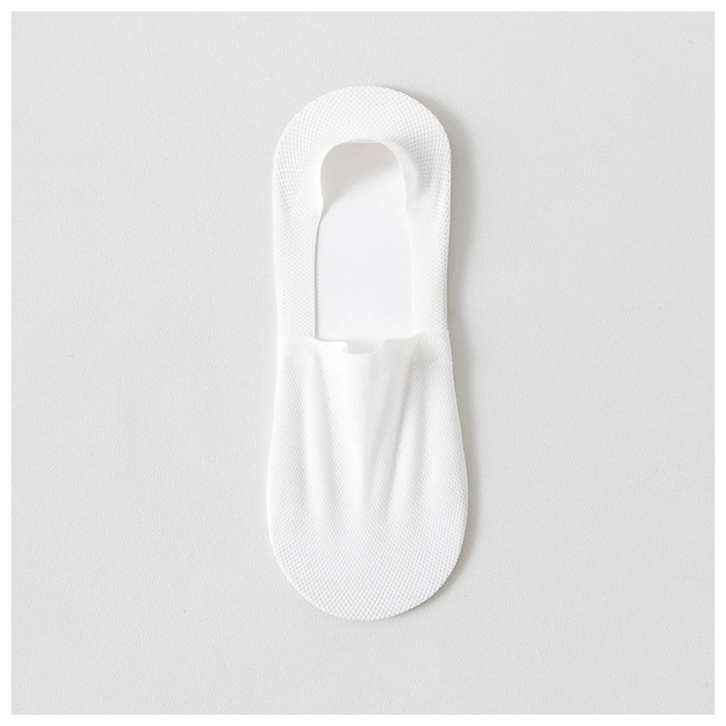 Single white invisible sock laid flat to show its low-cut shape and breathable mesh fabric