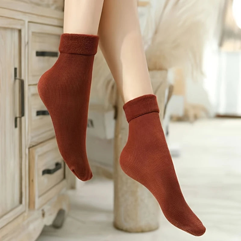 Rust brown fleece-lined indoor socks worn above the ankle at home