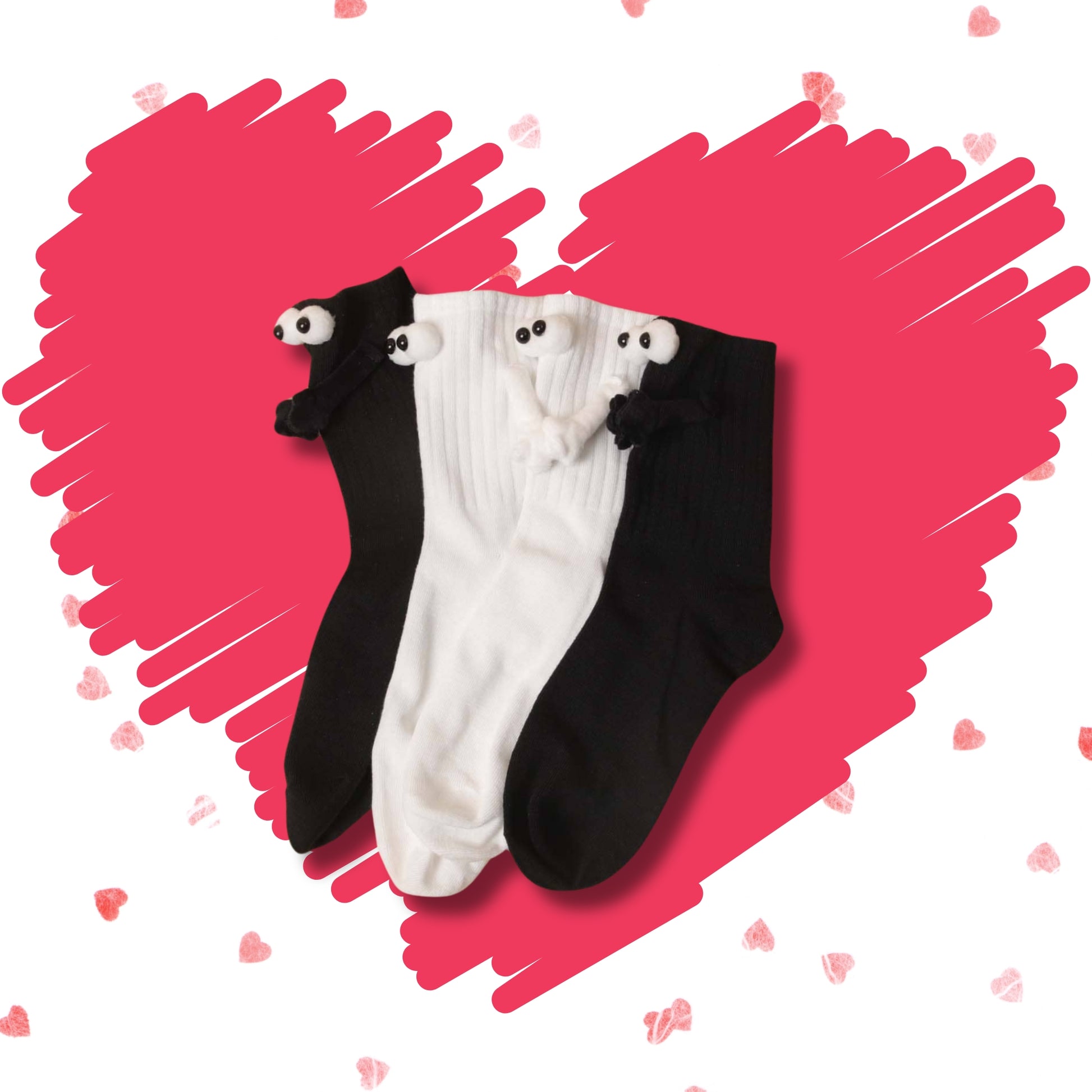 Black and white Soulmates crew socks grouped together with character eyes and joined hands