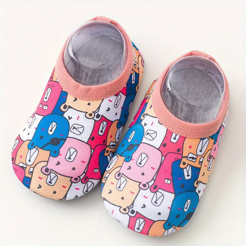 Pair of colorful children's shoes with cartoon designs on a white background