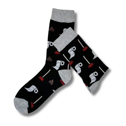 Pair of black toilet-themed crew socks crossed to show the full novelty pattern