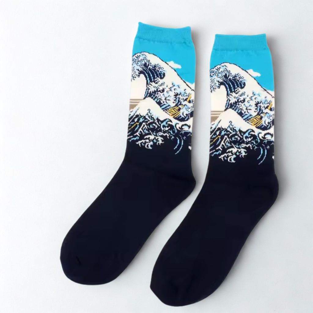 Pair of Great Wave of Kanagawa crew socks with turquoise cuffs and navy feet