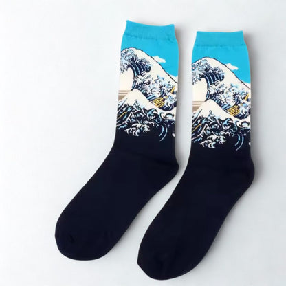 Pair of Great Wave of Kanagawa crew socks with turquoise cuffs and navy feet
