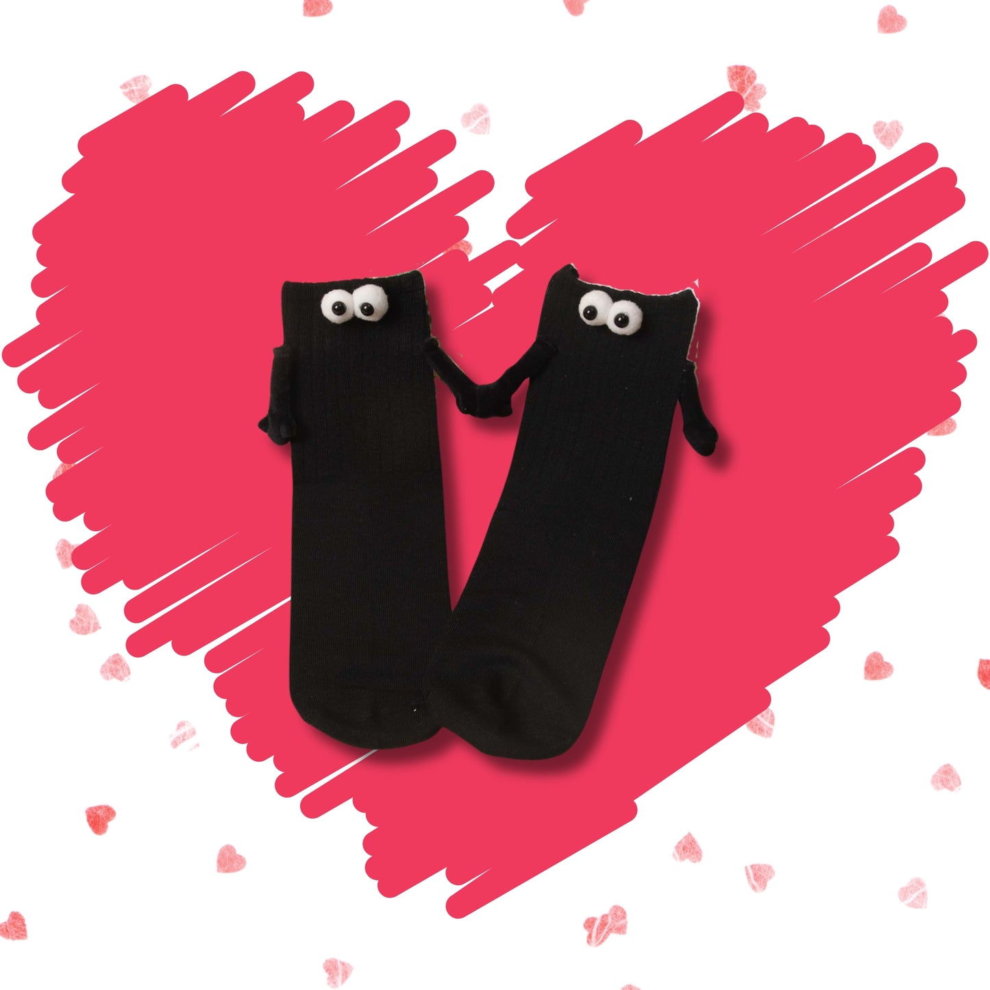 Pair of black Soulmates crew socks holding hands on a pink heart background