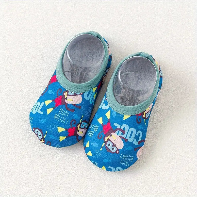 Pair of blue children's shoes with cartoon characters on a white background