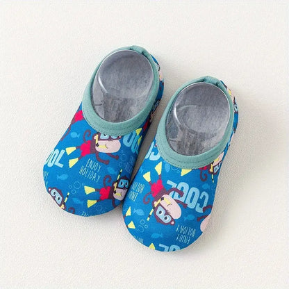 Pair of blue children's shoes with cartoon characters on a white background