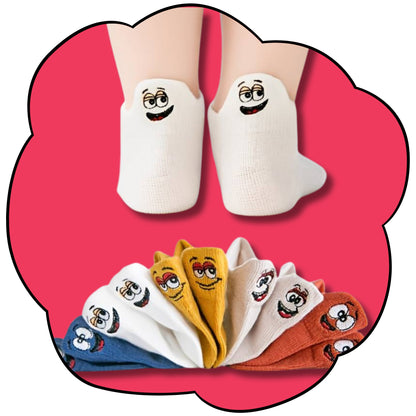 Five-pack of colourful kids ankle socks with embroidered character faces on a pink flower background