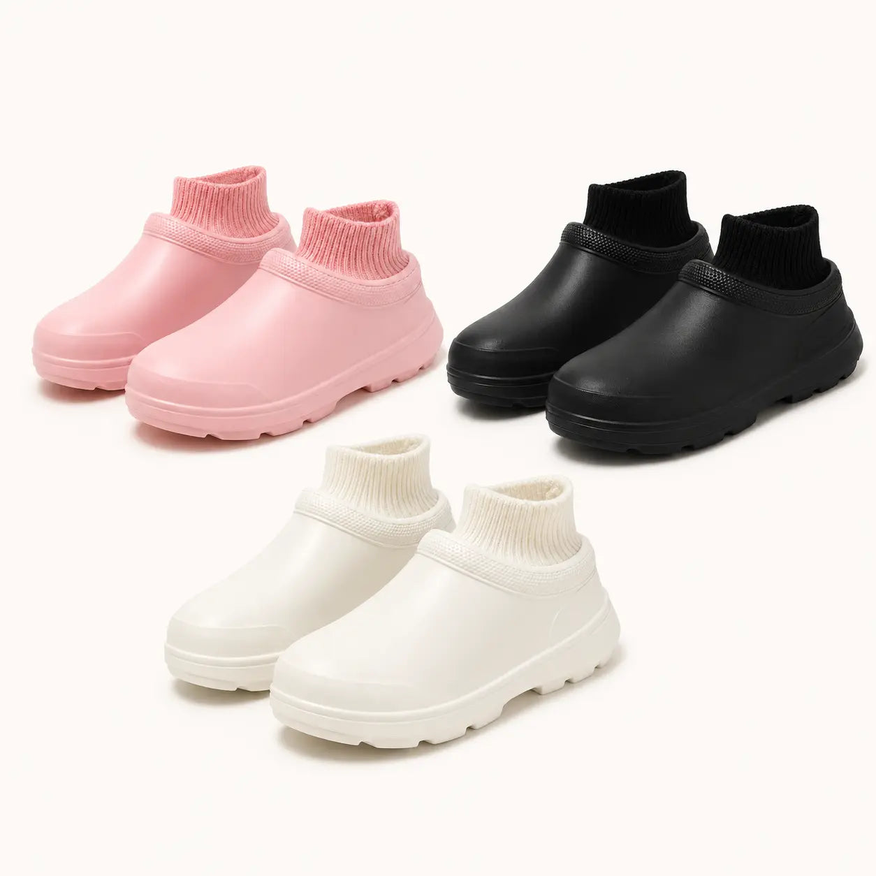 Pink, black and white SmileyClox fleece-lined slip-on clogs displayed together