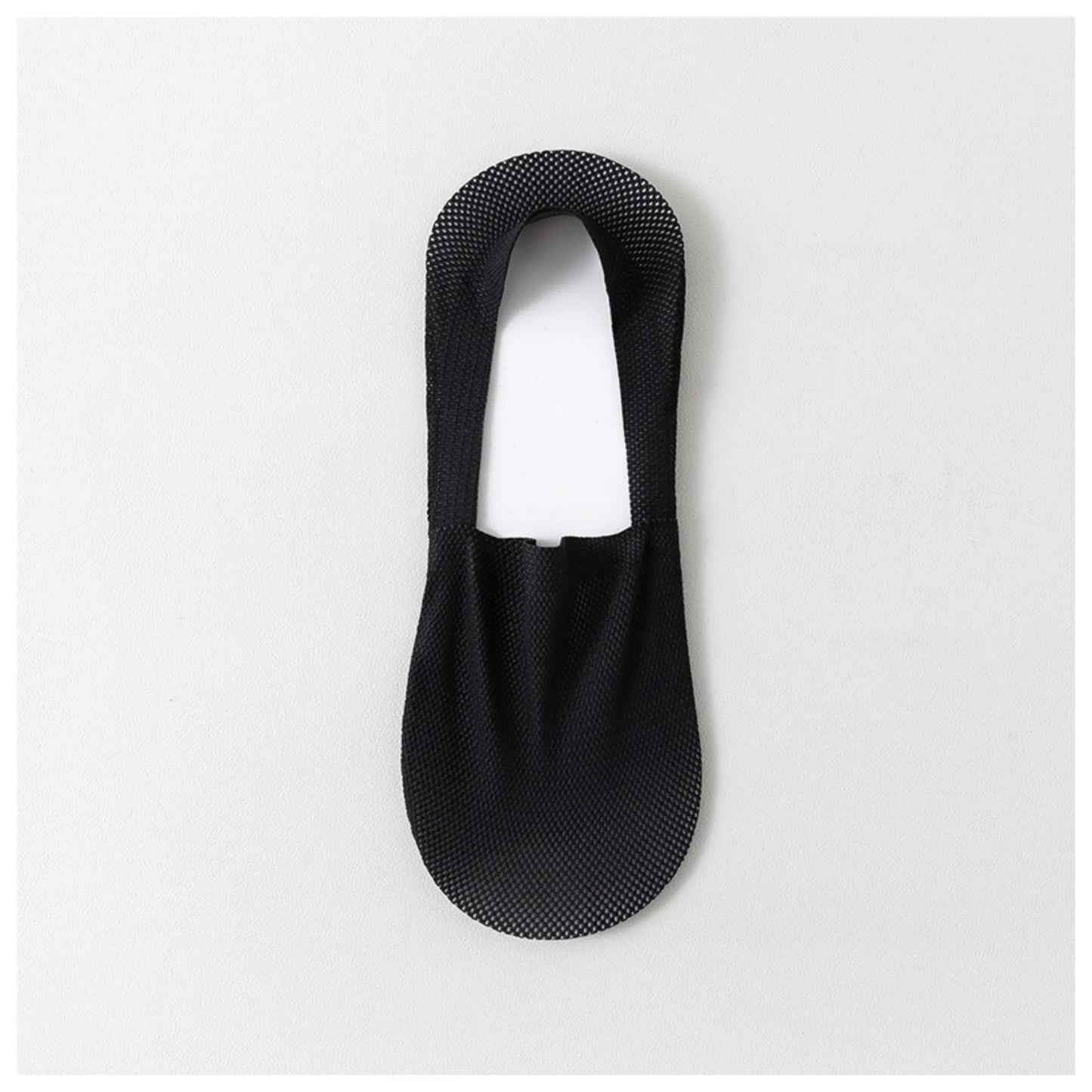 Single black invisible sock laid flat to show its low-cut shape and breathable mesh fabric