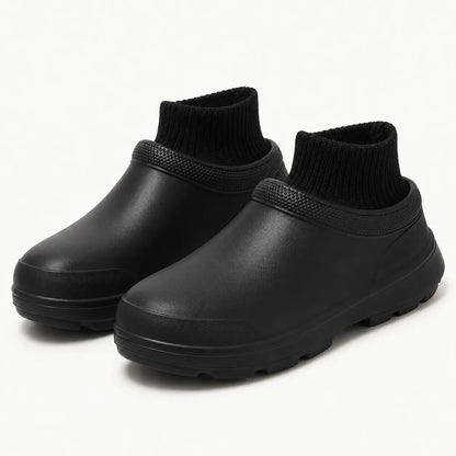 Close-up of the soft ribbed fleece lining and water-resistant outer shell of a white clog
