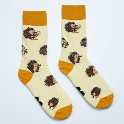 Pair of cream echidna crew socks with mustard cuffs, heels and toes arranged heel to heel