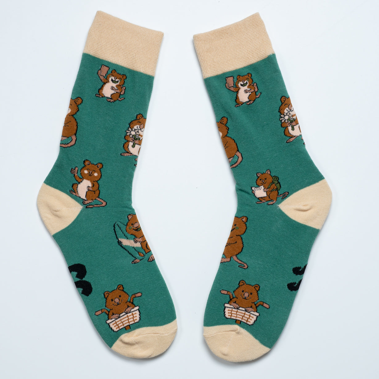 Pair of green Quokka crew socks with beige cuffs, heels and toes arranged heel to heel