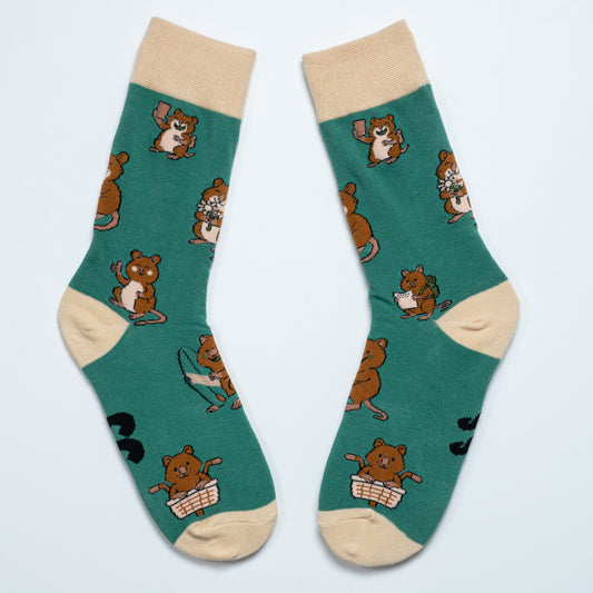 Pair of green Quokka crew socks with beige cuffs, heels and toes arranged heel to heel