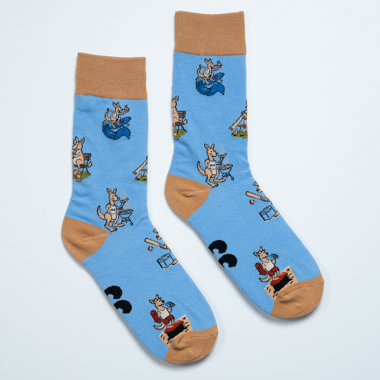 Pair of blue kangaroo socks laid side by side with playful Australian lifestyle scenes