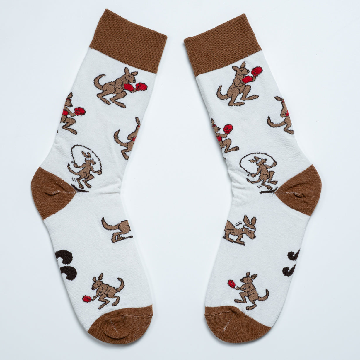 White kangaroo crew socks laid diagonally with brown cuffs, heels and toes