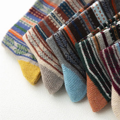 Close-up of five wool blend socks showing their assorted coloured toes and striped patterns