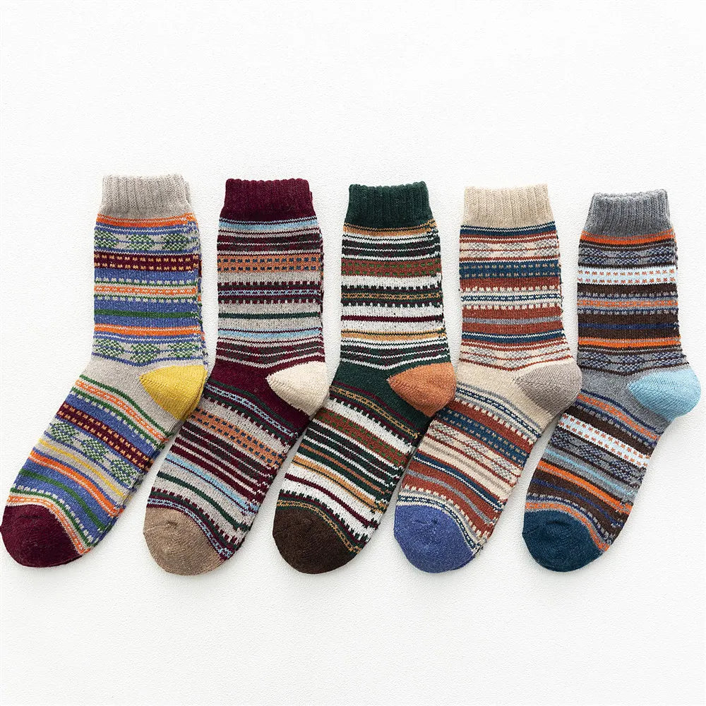 Five Toasty Threads wool blend socks lined up with colourful vintage striped patterns