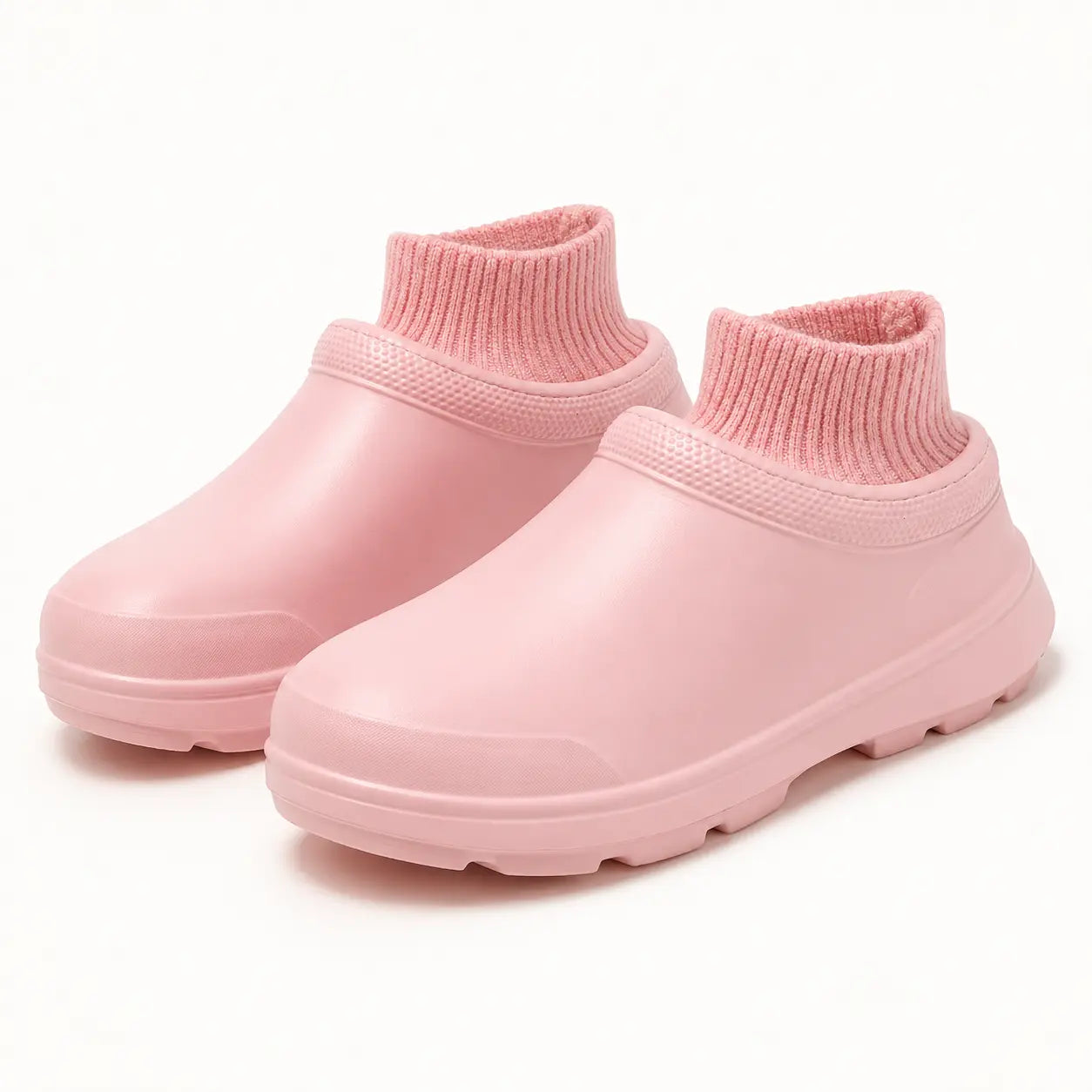 Pair of pink SmileyClox fleece-lined slip-on clogs on a light studio background
