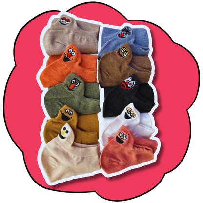 Ten folded ankle socks in assorted colours showing their embroidered character faces