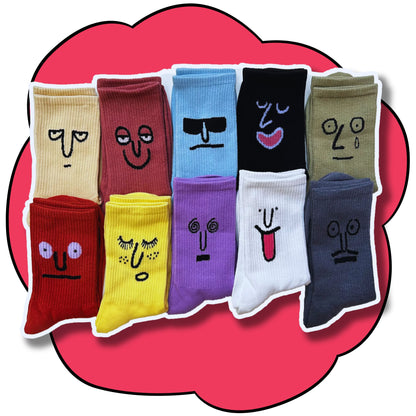 Ten colourful crew socks displayed in two rows with different embroidered facial expressions