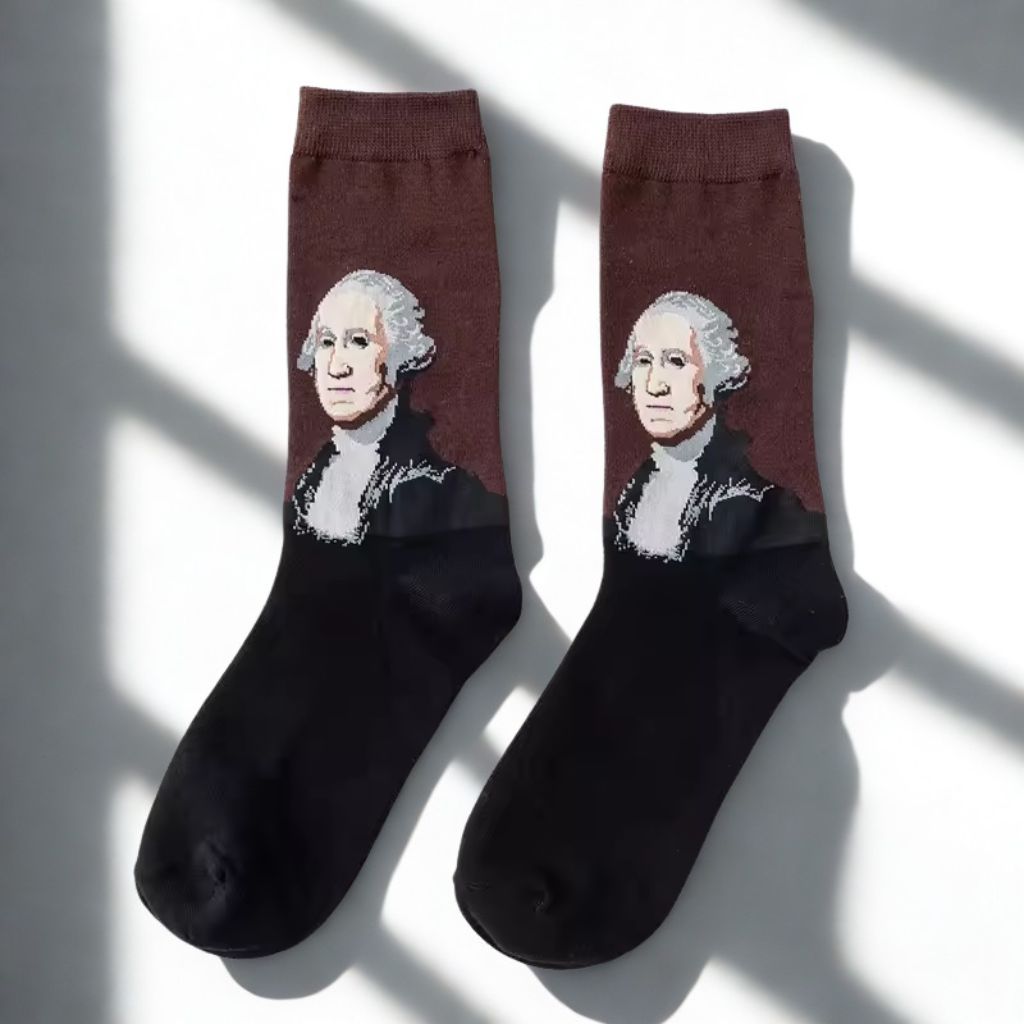 Pair of brown and black George Washington portrait crew socks displayed in natural window light