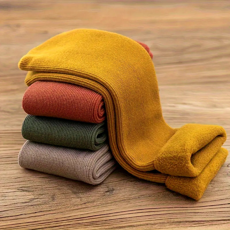 Stack of mustard, rust, green and taupe fleece-lined winter socks