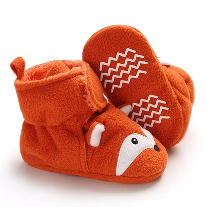 Orange fox baby bootie socks showing the textured non-slip sole grips