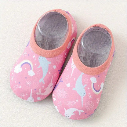 Pair of pink children's shoes with animal prints on a light background
