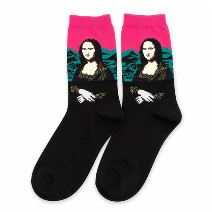 Pair of black Mona Lisa crew socks with bright pink cuffs on a white background