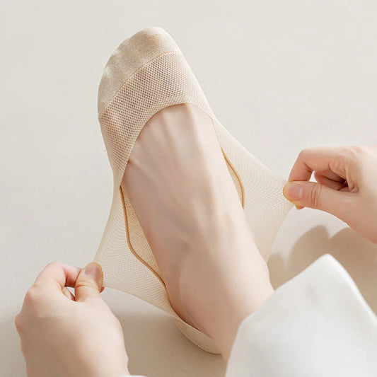 Nude BareLite ultra low-cut footie sock stretched by hand to show its flexible breathable mesh