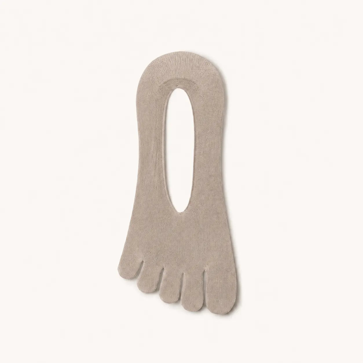 Single sand beige BareToe five-toe invisible sock laid flat on a light background