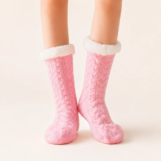 Pink sherpa-lined slipper socks worn on feet