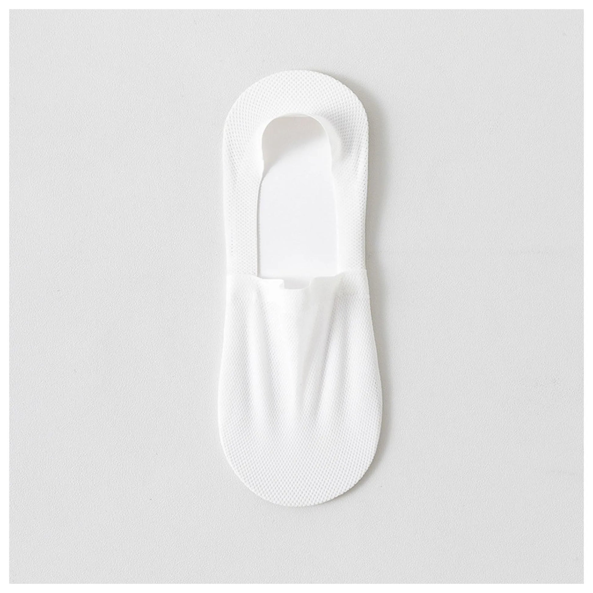 Single white invisible sock laid flat to show its low-cut shape and breathable mesh fabric