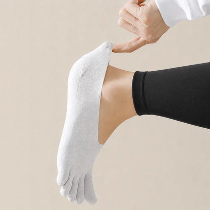 White BareToe invisible sock stretched at the toe to demonstrate its flexible lightweight fabric